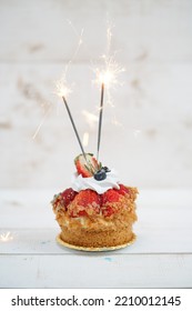 Happy Birthday. Birthday Cake isolated on a white wooden background with sparkler. - Shutterstock ID 2210012145