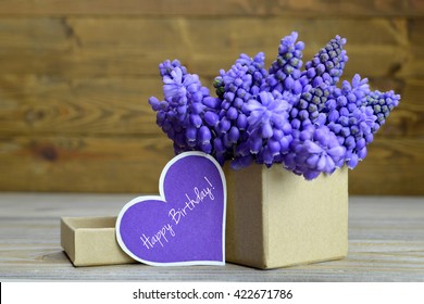 Happy Birthday card and flowers arranged in gift box
