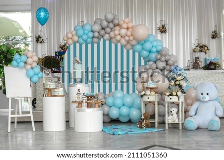 Happy Birthday! Children's decoration with glowing lights, birthday garland, different color of balloons. Decorated photo zone. Festive decorative elements, photo area