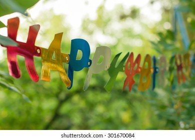 Happy Birthday Greeting Colorful Banner. Detail From Backyard Party.