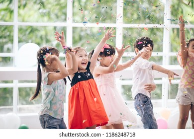 Happy Birthday Party Asian  Children With Friendship  In Confetti Carnival Or Celebration Party  Birthday Or  New Year Christmas