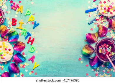Happy Birthday Party Background With Text, Drinks, Cupcake And Colorful Tools, Top View. Happy Birthday Greeting Card