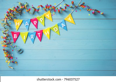 Happy birthday party background with text and colorful tools, top view