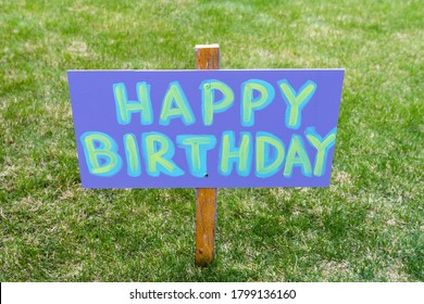 Happy Birthday Party Home Made Sign Staked In A Grassy Field