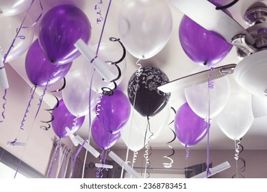 Happy birthday! Purple, white helium filled balloons. Love letters tied with ribbon. Balloon. Ceiling. Room interior. Romantic surprise. Romance. Appreciation. Partner, spouse. Celebrate. Anniversary.