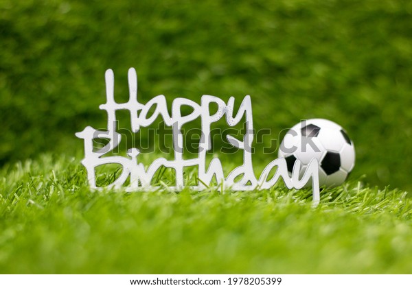 happy-birthday-sign-with-soccer-ball-on-green-grass