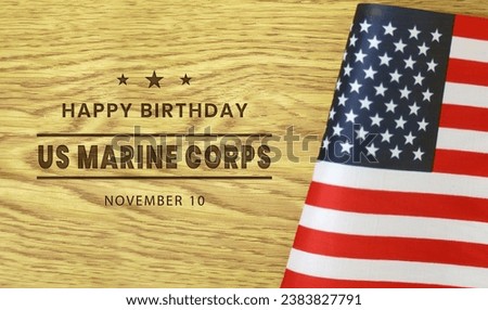 Happy birthday United States Marine corps greeting card on wooden table background.