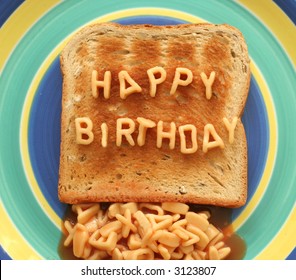 Happy Birthday Written With Alphabetti Spaghetti Pasta Shapes On Toast