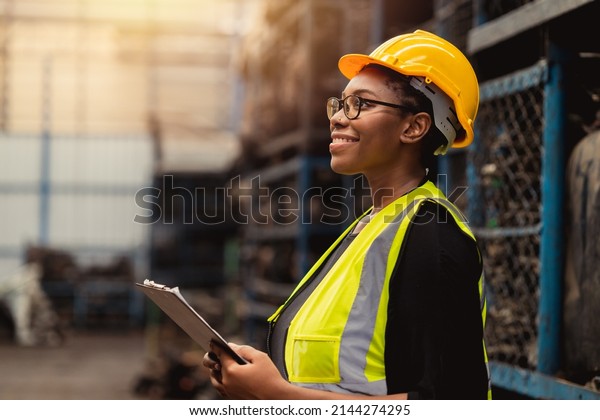 Happy Black African women engineer worker enjoy\
working in factory\
industry.