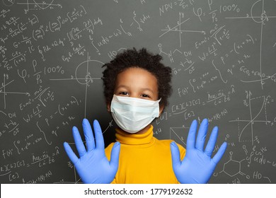 Happy Black Child In Protective Medical Face Mask, Back To School And Covid-19 Concept