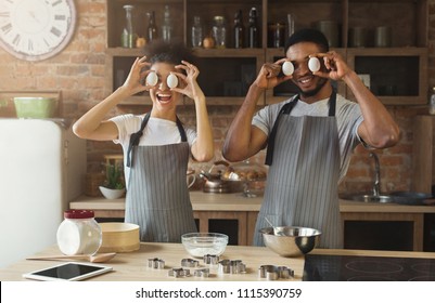 Happy Black Couple Baking Pie And Having Fun In Loft Kitchen