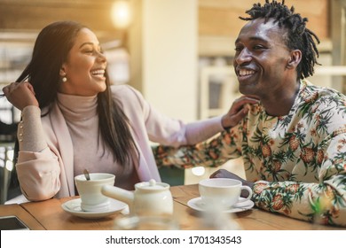 Happy Black Couple Drinking Tea At Home During Isolation Quarantine - Young People Having Fun Together During Lockdown World Situation - Domestic Lifestyle Concept - Focus On Man Face