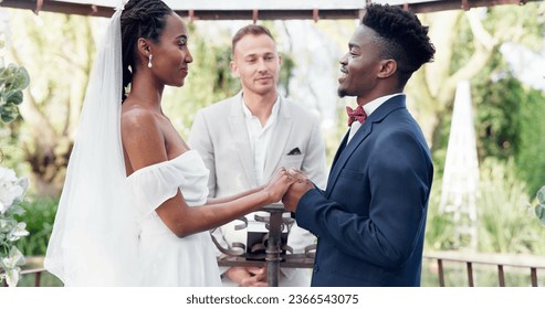 Happy black couple, wedding and vows in marriage, commitment or support together at alter. Married African woman and man holding hands for love, trust or speech of bride or groom in outdoor romance
