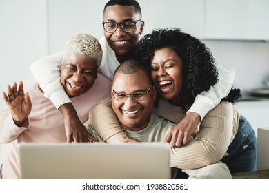 Happy Black Family Doing Video Call At Home - Main Focus On Father Face