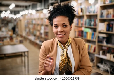 Happy Black Female Professor Teaching Via Video Call From University Library. 