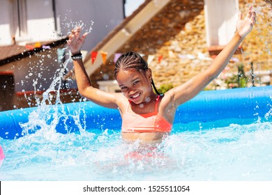 Happy Black Girl Portrait Splash In A Swiming Pool