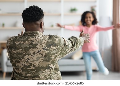 Happy Black Girl Teenager Running Into Her Daddy Unrecognizable Man In Military Uniform Arms, Back View Of African American Soldier Return Home From Army, Family Reunion At Home Concept