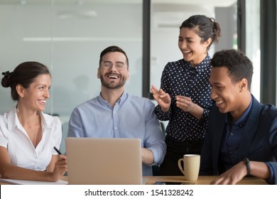 Happy Black, Indian And Caucasian Diverse Female And Male Colleagues Enjoying Positive Emotions. Multiracial Managers Group Having Fun At Break Or During Business Meeting In Board Room At Work