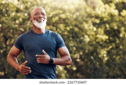 Happy black man running in park with music, smile and mockup in nature, garden and workout. Senior male, outdoor runner and motivation for fitness, energy and healthy exercise training with earphones - Shutterstock ID 2267710607