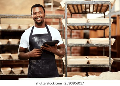 Happy black man, tablet and portrait in bakery or small business to check stock or order. Technology, smile and face of professional baker in factory for manufacturing or food production in Nigeria - Powered by Shutterstock