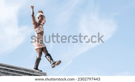 Similar – Image, Stock Photo Cheerful non-binary person dancing on the street in the city