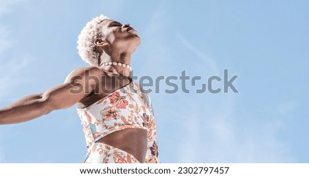 Similar – Image, Stock Photo Cheerful non-binary person dancing on the street in the city