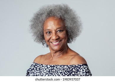 Happy black senior woman in a studio shoot - Powered by Shutterstock