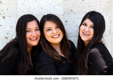 Happy Black Straight Hair Latin Adult Sisters Dressed In Black For Family Photo Shoot In Harmony And Joy
