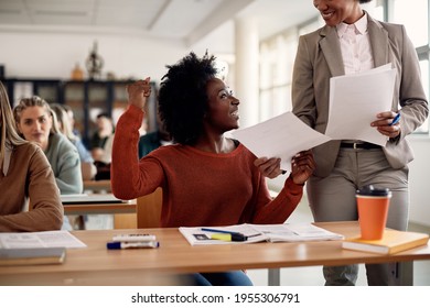 Happy Black Student Celebrating Getting A Good Grade On The Test She Received From Professor At The University.