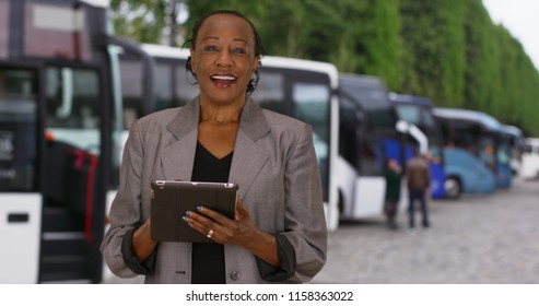 Happy Black Woman In Business Suit Using Technology And Talking To Camera