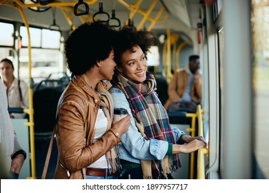 Happy Black Woman Commuting With Her Female Friend In A Public Transport. 
