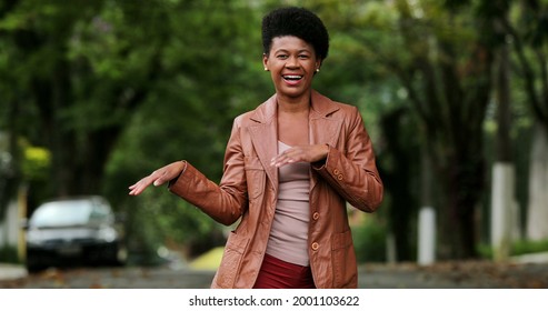 Happy Black Woman Dancing Outside. One Groovy African Person Dance