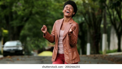 Happy Black Woman Dancing Outside. One Groovy African Person Dance