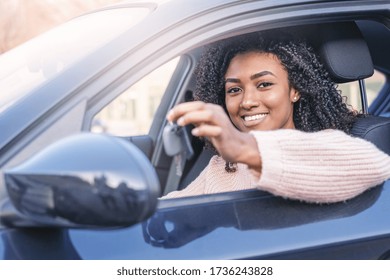 Happy Black Woman Driving Her New Car Holding Key