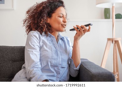 Happy Black Woman Making A Phone Call Using Voice Notes