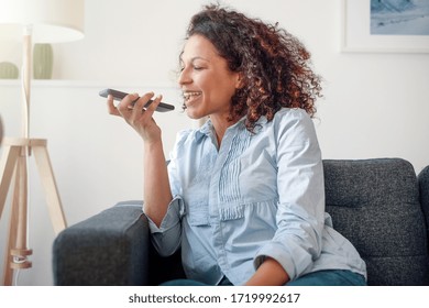 Happy Black Woman Making A Phone Call Using Voice Notes