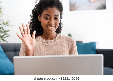 Happy black woman using video call to connect with family