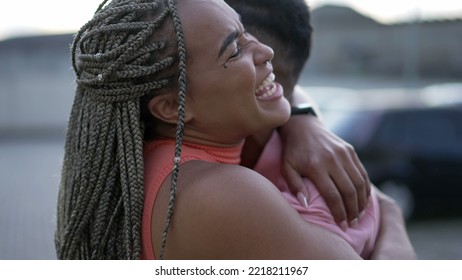 A Happy Black Young Woman Embracing Family Member. Brazilian Sister Embraces Brother. South American People Love And Affection. Person Hugging