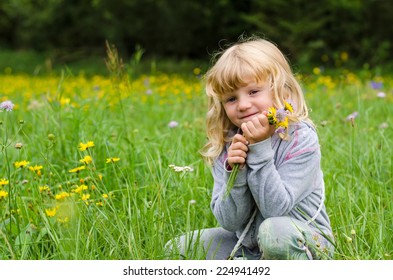 happy blond girl yellow flowers