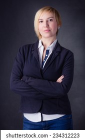 Happy Blonde Business Woman Isolated On Dark Background