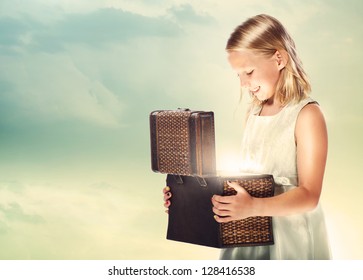 Happy Blonde Girl Opening A Treasure Box