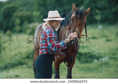 Similar – Image, Stock Photo Portrait of adult woman with beautiful horse in nature. Sunlight, silhouette.Concept of love for lesser brothers, caring and animal training