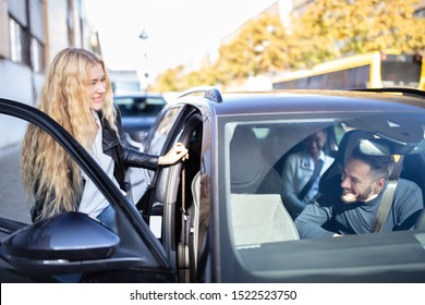 Happy Blonde Women Sitting Inside Car With Her Friends - Powered by Shutterstock