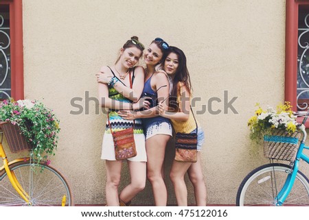 Similar – Happy young people walking along road in summer day