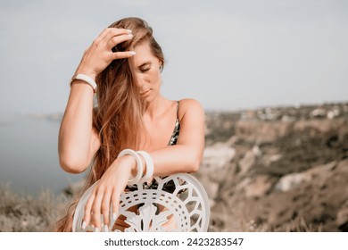 Happy boho woman portrait. Boho chic fashion style. Outdoor photo of free happy woman with long hair, sunny weather outdoors with sea mountains nature beautiful background. - Powered by Shutterstock