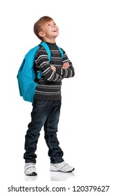 Happy boy with backpack looking up isolated on white background