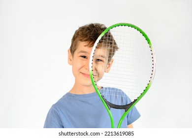 Happy Boy In Badminton Rackets Action On White Background. Children's Badminton Improves Agility And Quick Reflexes, As Well As Coordination, Balance And Concentration