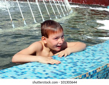 happy boy bathing in the fountain