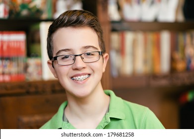 Happy Boy With Braces And Glasses. Smiling