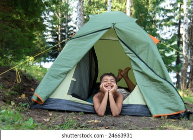 Happy Boy In Camping Tent